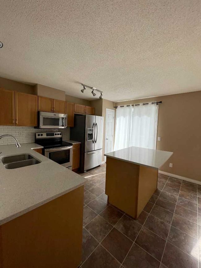 3026 New Brighton Gardens Se, Home with 2 bedrooms, 2 bathrooms and 2 parking in Calgary AB | Image 4