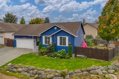 2 car garage, but also an extra parking spot on left of driveway. | Image 1