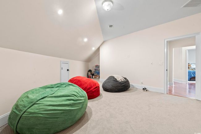 Sitting room featuring carpet flooring, lofted ceiling, baseboards, and recessed lighting | Image 27