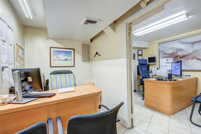 Office space with light tile patterned floors | Image 5