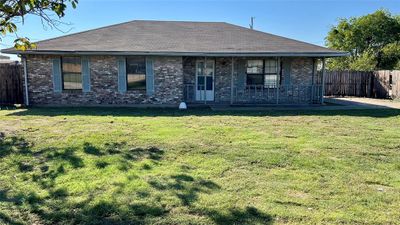 Back of house with a lawn | Image 1