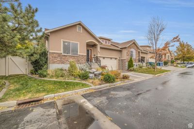 View of front of property featuring a front yard and a garage | Image 3