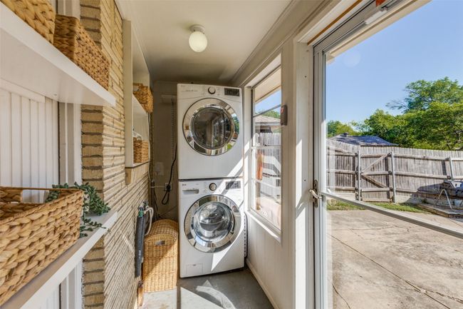 Laundry area with stacked washer and dryer | Image 20