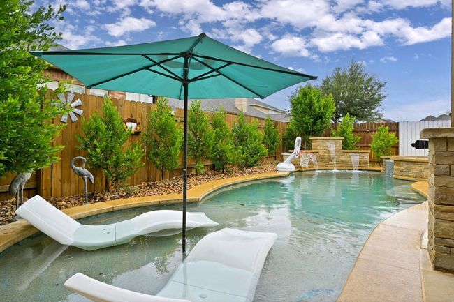 View of pool featuring a fenced backyard | Image 29