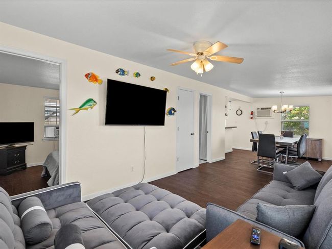 The living area opens to the dining area | Image 36