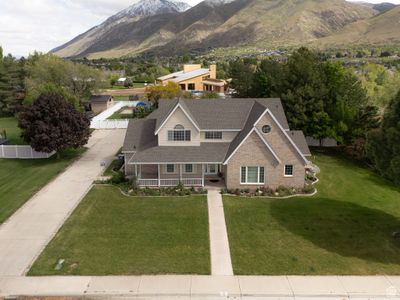 View of front facade with a mountain view and a front yard | Image 2