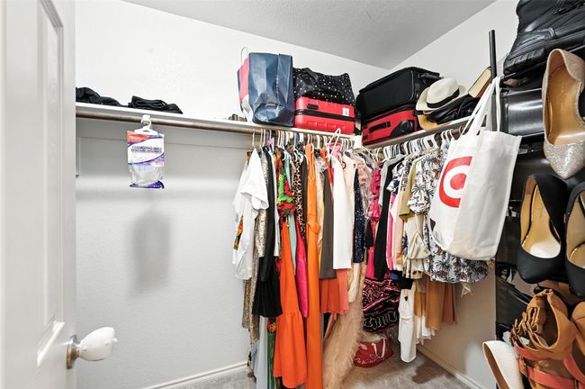 Spacious closet with carpet flooring | Image 29
