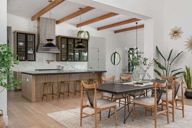 Dining space featuring light wood-style floors and beamed ceiling | Image 8