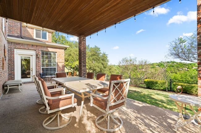 One of two large covered patios off of the kitchen and breakfast areas. | Image 26