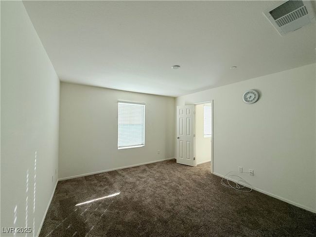 Unfurnished room featuring visible vents, baseboards, and carpet | Image 9