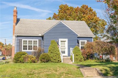 Cape Cod-style home with a front yard | Image 2