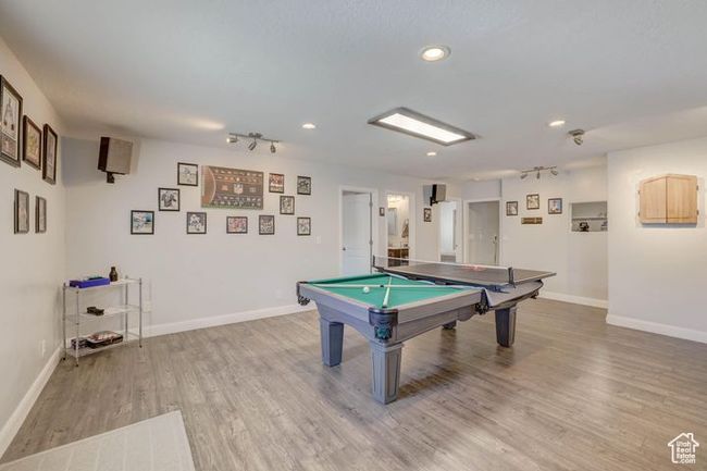 Rec room featuring light wood finished floors, baseboards, recessed lighting, and billiards | Image 11