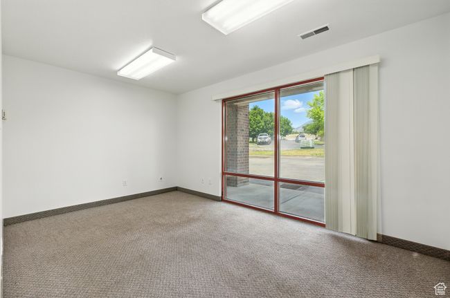 Spare room with carpet and baseboards | Image 12