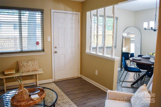Opening from the den into the dining room. Rooms overlook the backyard. | Image 29