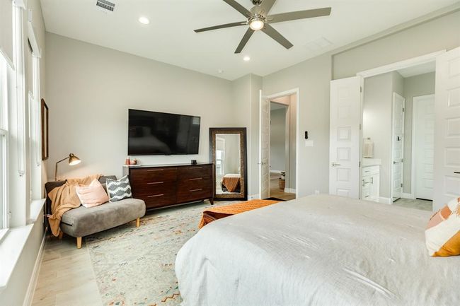Large windows grace the room, allowing natural light in! | Image 22