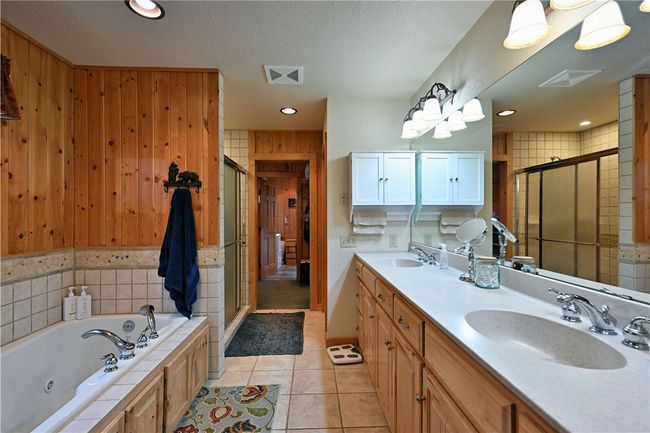 Master bathroom with jetted tub and walk-in closet. | Image 25