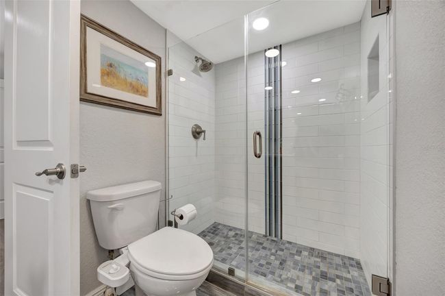 Bath 1 has a walk in modern shower | Image 12