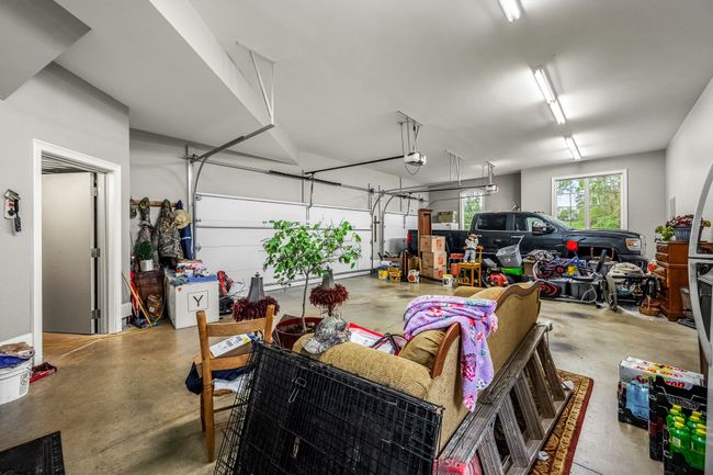The spacious design accommodates multiple vehicles, providing ample room for cars, motorcycles, and even storage for tools and equipment. | Image 65