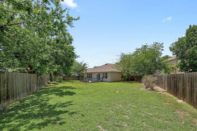 View of fenced backyard | Image 26