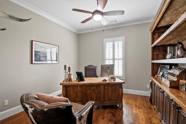 Office featuring ceiling fan, dark wood-type flooring, and ornamental molding | Image 20