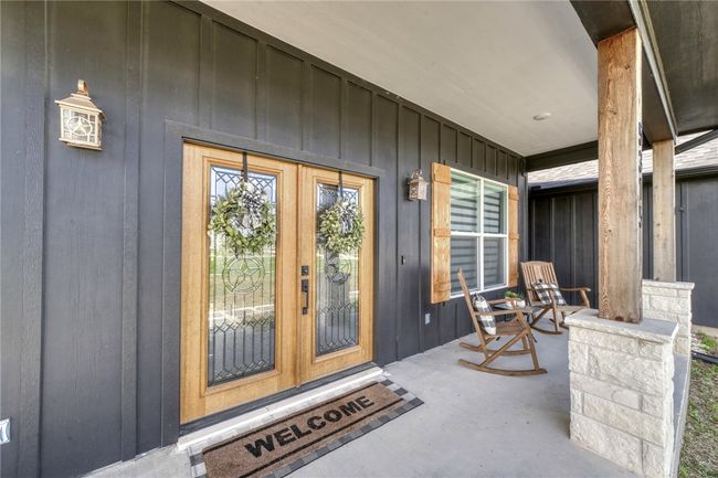 View of exterior entry with a porch | Image 8