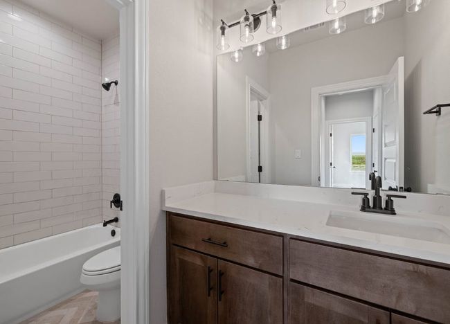 Bathroom featuring shower / bathing tub combination, vanity, and toilet | Image 24
