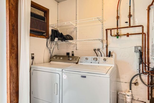 Main floor laundry area. In floor heating system/on demand water heater is approx 3 years old. This was a $22K upgrade! | Image 29