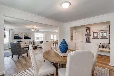 Dining area with ornamental molding, ceiling fan, and light hardwood / wood-style floors | Image 2