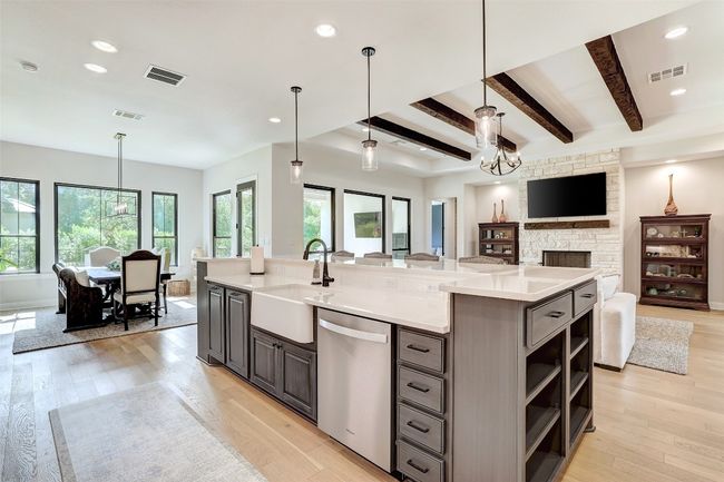 Kitchen featuring island and open to living room | Image 11