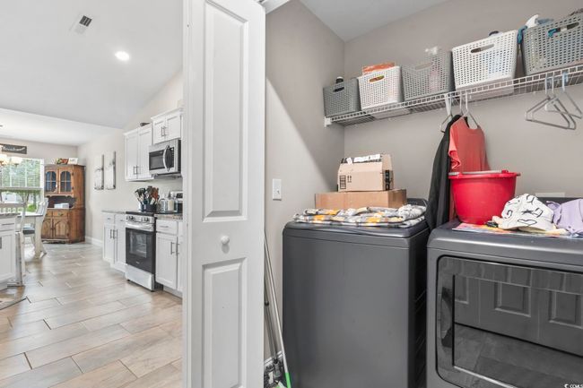 Washroom with washer and clothes dryer | Image 16