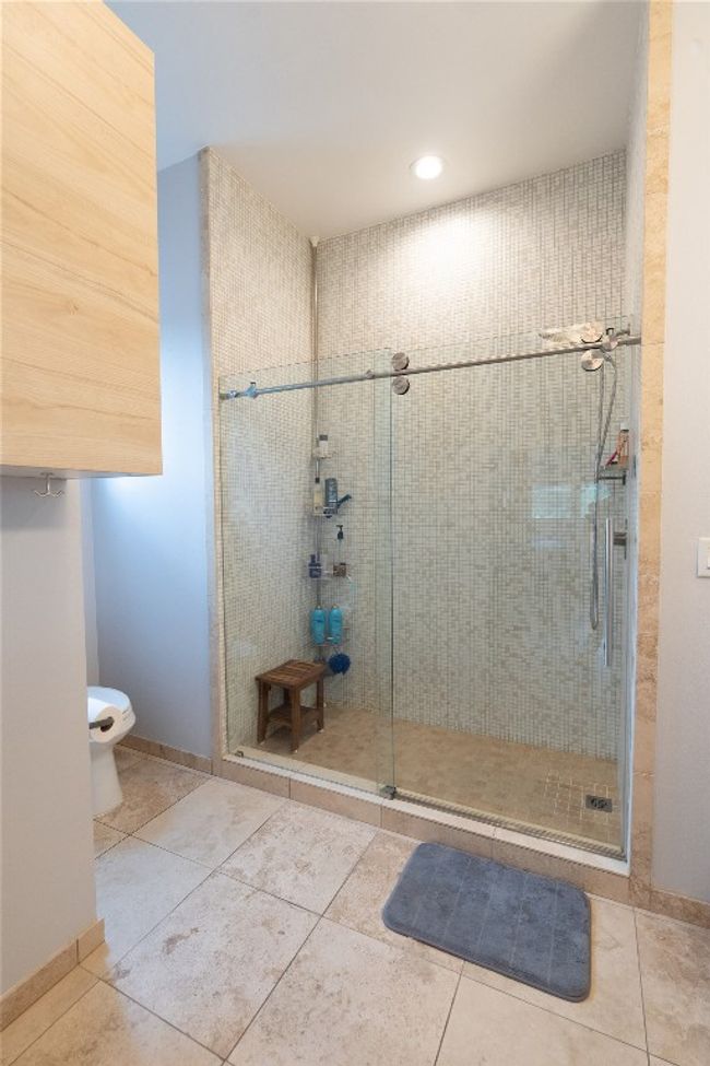 Full bath with a stall shower, tile patterned floors, and recessed lighting | Image 19
