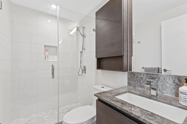 Bathroom featuring a stall shower, vanity, and toilet | Image 20