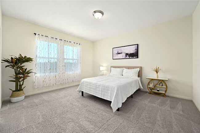 Bedroom featuring carpet floors and baseboards | Image 23