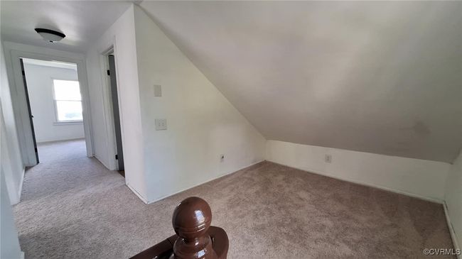 Additional living space with carpet flooring and lofted ceiling | Image 28
