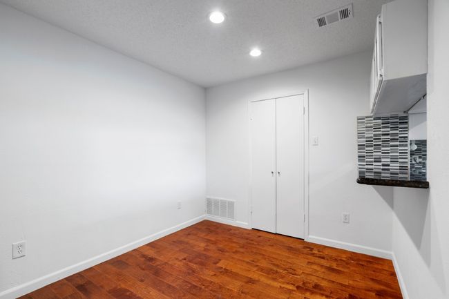 Bedroom with baseboards, wood-style floors. | Image 10
