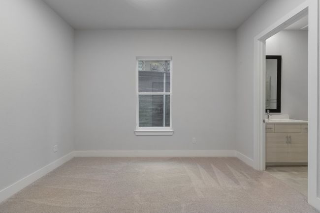Spare room with light colored carpet and baseboards | Image 7