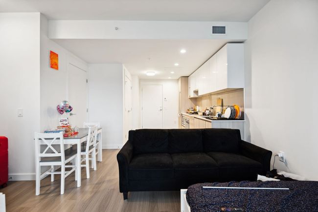 Living area with baseboards, visible vents, recessed lighting, and light wood-type flooring | Image 10