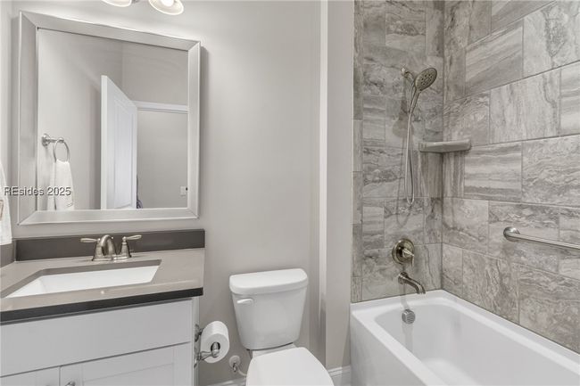 Guest Bathroom iwth Quartz counters and Tiled Shower | Image 23