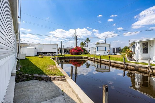 Dock area featuring a yard and a water view | Image 29