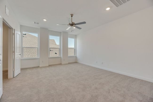 Empty room featuring light carpet, a ceiling fan, and recessed lighting | Image 13