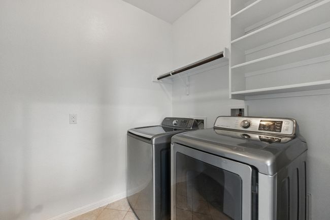 1st floor laundry room with storage | Image 13