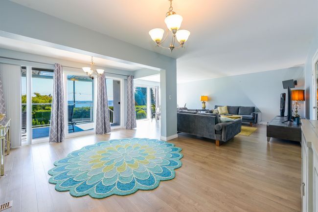 Foyer entrance featuring a chandelier and wood finished floors | Image 27