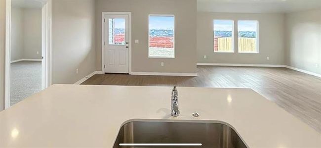 Entryway featuring wood finished floors and baseboards | Image 4