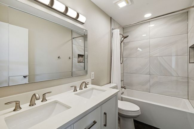 Beautifully updated guest bathroom upstairs | Image 24