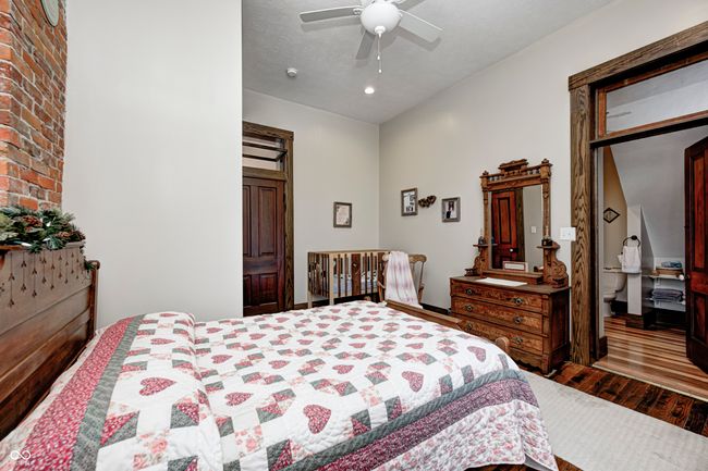 bedroom featuring wood finished floors and a ceiling fan | Image 30