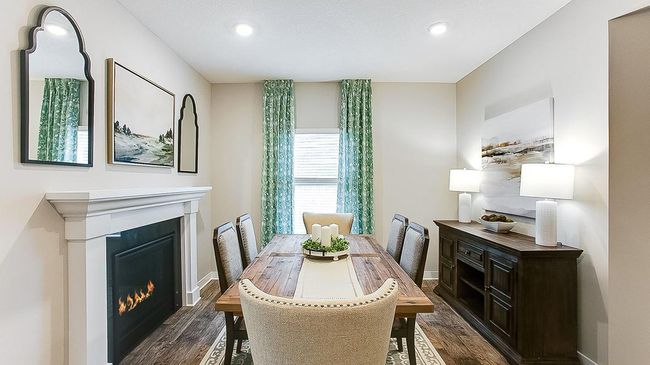 Two-sided fireplace means you can enjoy both in your formal dining area (or additional living space) AND in your family room! | Image 16