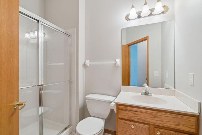 Lower level three quarter bath, custom oak cabinets | Image 25