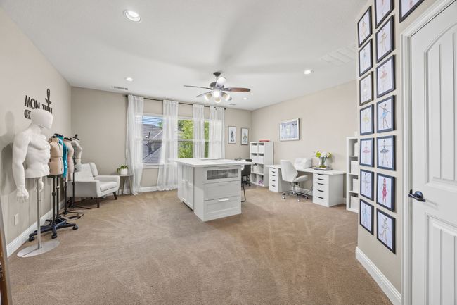 Large upstairs game room has french doors and a closet and is currently being used as a studio/office | Image 28