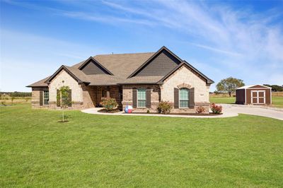 View of front of house with a shed and a front lawn | Image 3