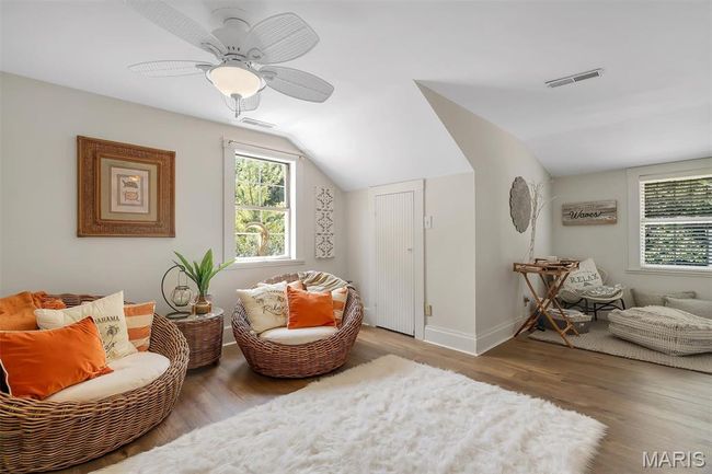 Sitting room featuring wood finished floors, lofted ceiling, and ceiling fan | Image 67